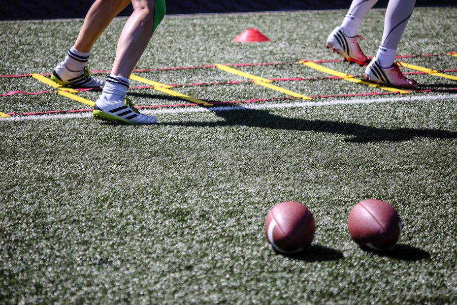 Players using agility equipment during field training