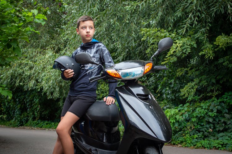 Teenager Boy With Motorbike