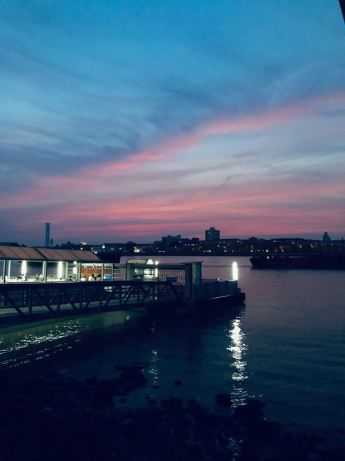 Free Stunning evening view of Shanghai's riverside skyline with a beautiful afterglow. Stock Photo