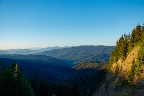 Scenic View of Mountain Ranges under Clear Blue Sky 