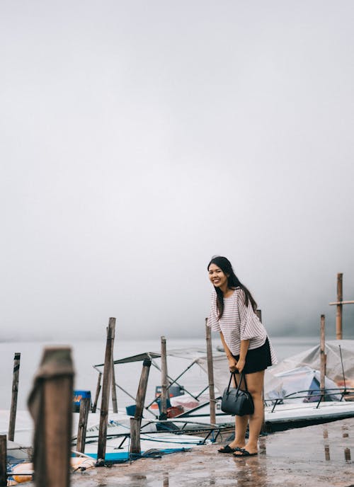 Woman in White and Gray Top