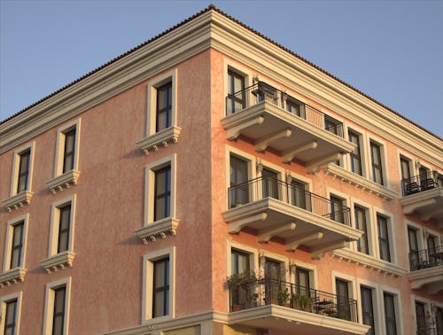 Brown Concrete Building Under Clear Sky 