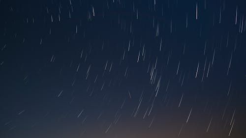 White Light Streaks Under Blue Sky