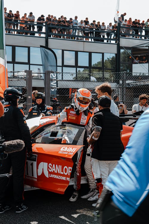 Men Around Racer in Car on Track · Free Stock Photo