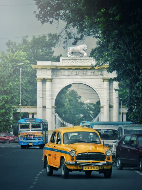 Photo of Yellow Taxi on Roadway