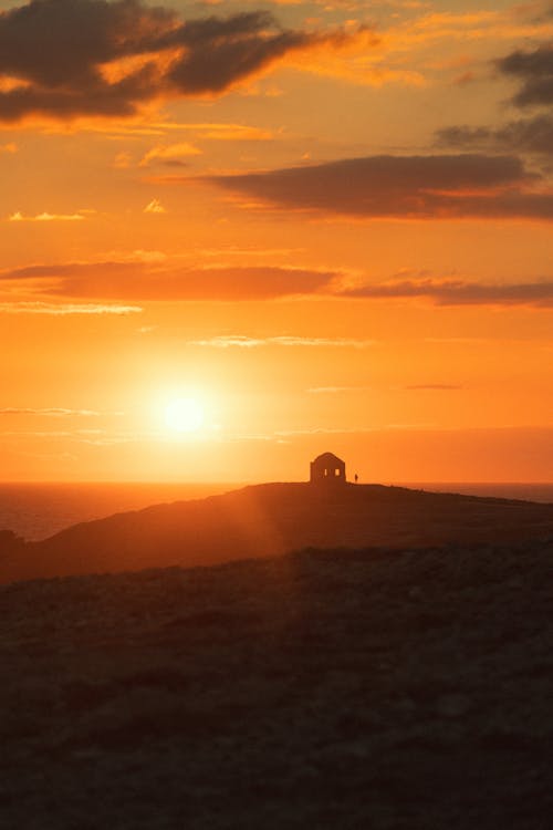 Silhouette of Building during Sunset