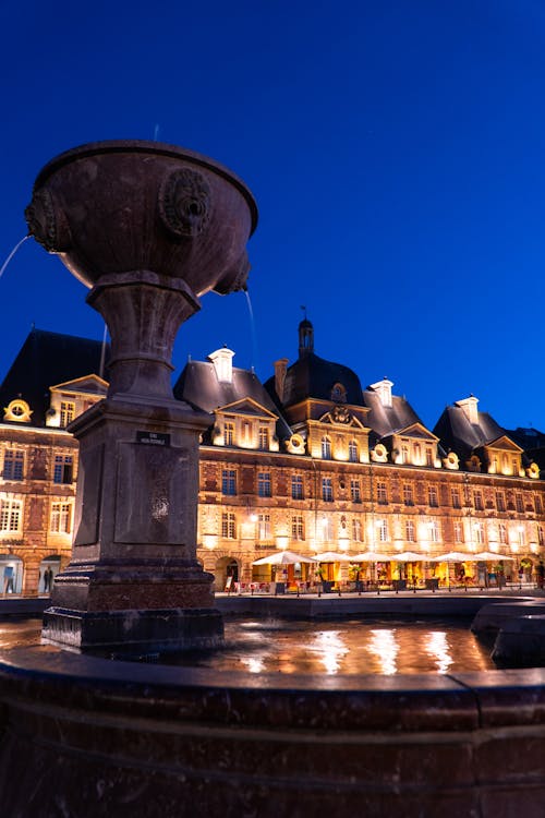 Fountain and Building in Light on City Square