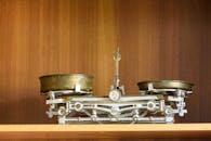 Vintage Brass Scale on a Wooden Shelf