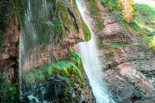 Cascading Waterfalls on a Mossy Mountain