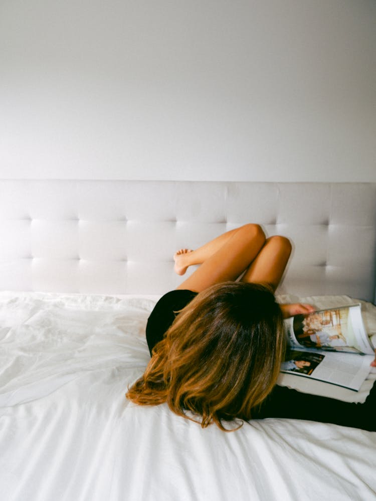 A Woman Reading A Magazine 