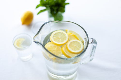 Free Sliced Lemon Fruit in Glass Picher Stock Photo