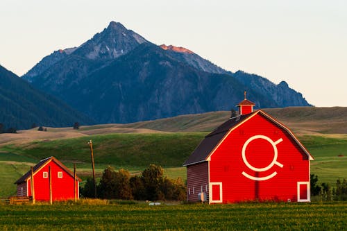 Majestic Mountains and Barns on Landscape