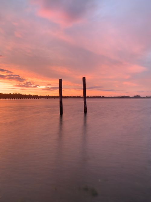 Free Captivating ocean view at sunset with tranquil waters and vivid skies. Stock Photo