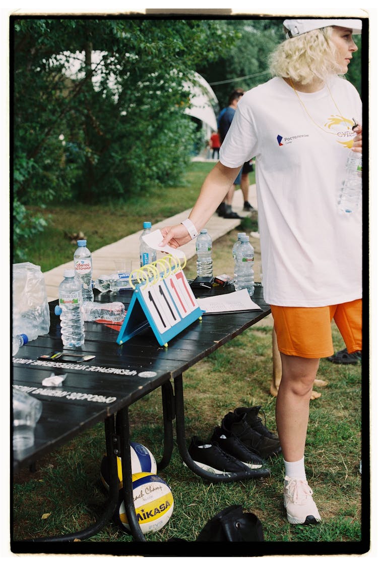 A Woman Turning The Scoreboard