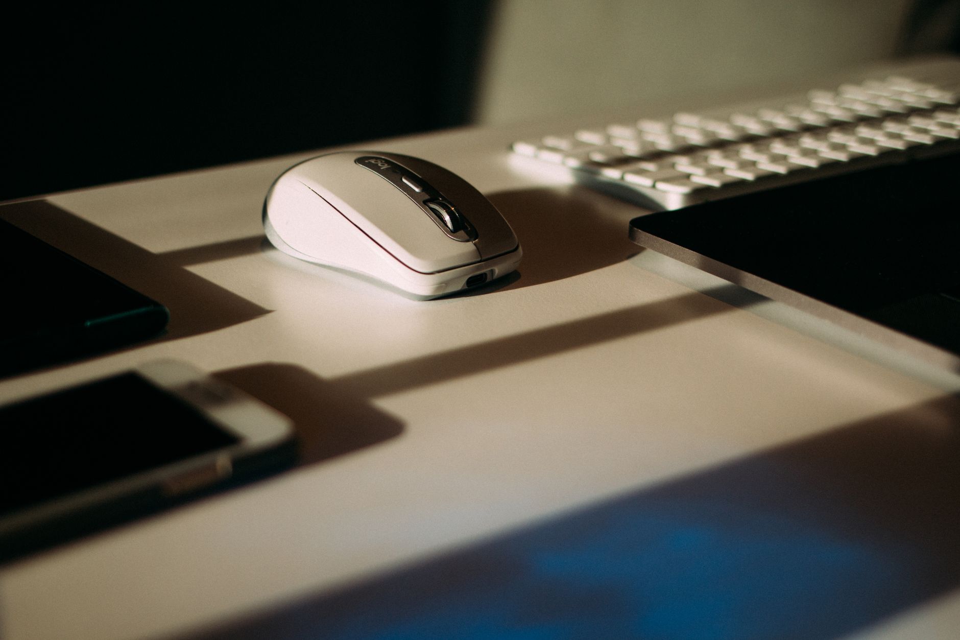 How to Use Your Phone with a Keyboard and Mouse: A Practical Guide Close-up of a mouse, keyboard, and smartphone in a modern workspace.