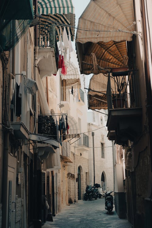 An Empty Alley in Between City Buildings