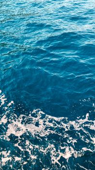 A serene view of ocean waves with calming ripples and foam, capturing nature's tranquility.