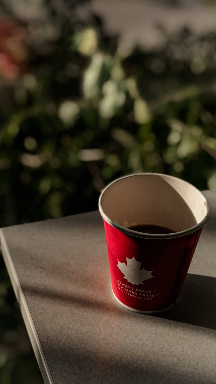 Red Disposable Cup With Coffee