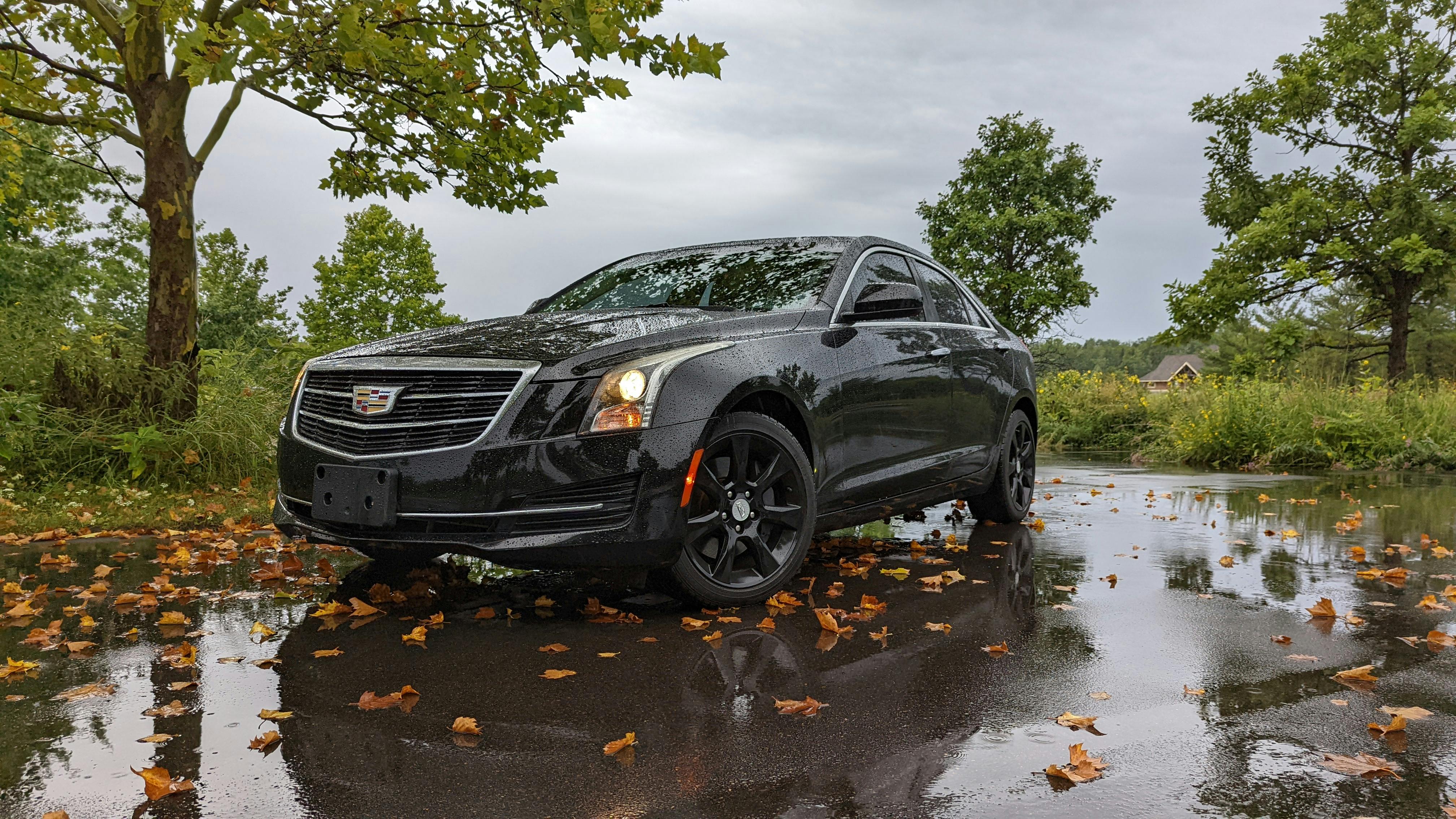 A Black Cadillac Car Parked on the Street · Free Stock Photo