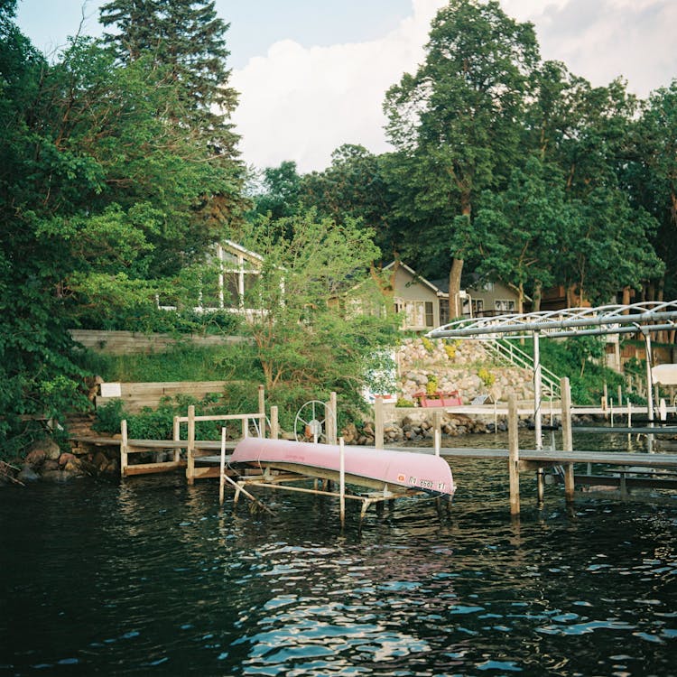 Pink Boat On Wooden Dock