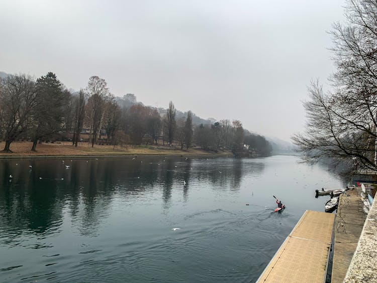 Person Kayaking On A River 