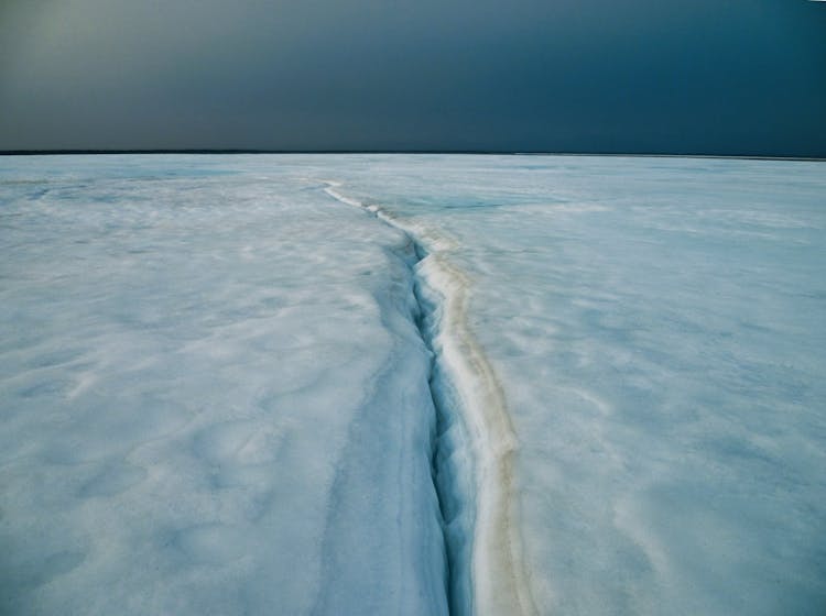 Crack In Ice On Frozen Lake