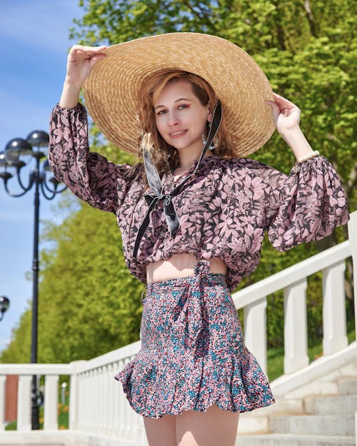 A Woman in Floral Shirt Wearing a Sombrero