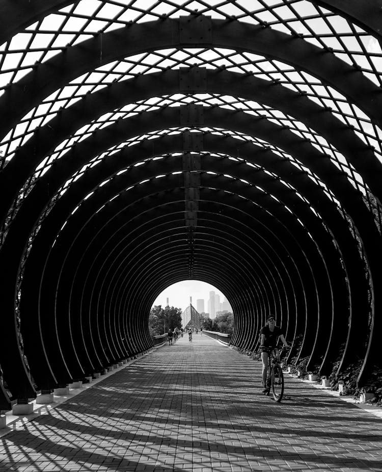 Cyclist Passing A Tunnel