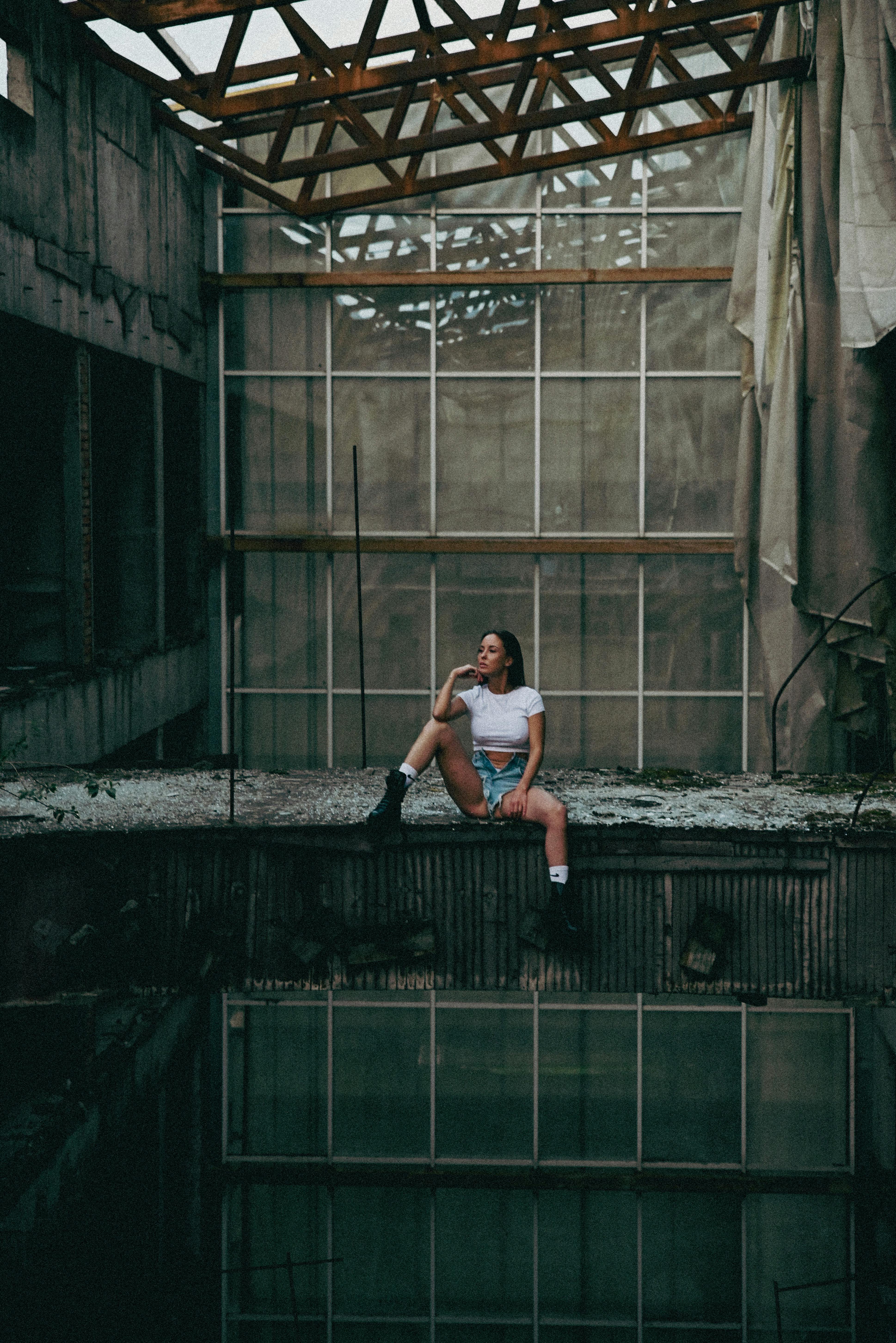 woman posing in abandoned building