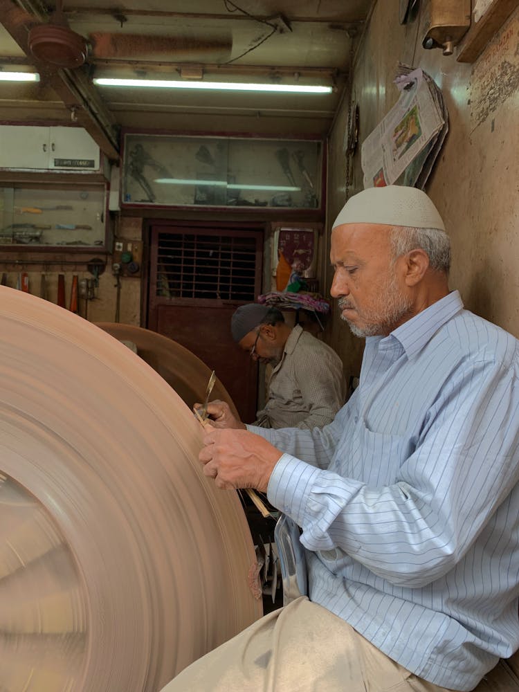 Men Sharping Knives