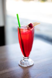 Bright red raspberry tonic over ice, photo by Valeria Boltneva on Pexels