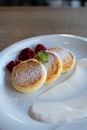 Delicious curd fritters with sour cream in cafeteria