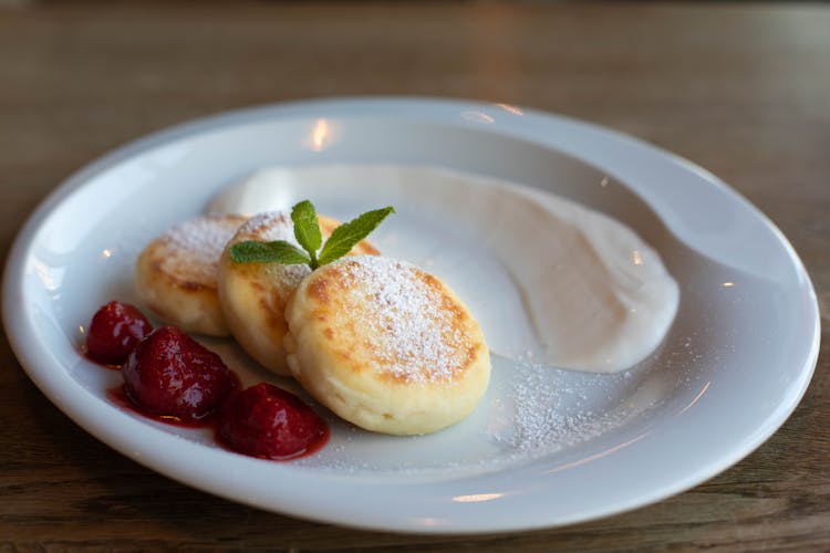 Tasty Cottage Cheese Pancakes With Strawberries And Sour Cream Sauce