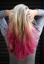 Woman in Gray Long-sleeved Top Holding Hair