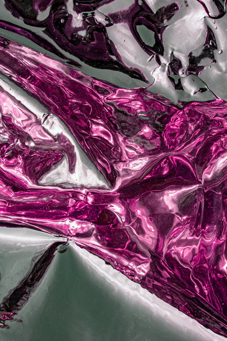 Close-up Photo Of A Glossy Metal Liquid 