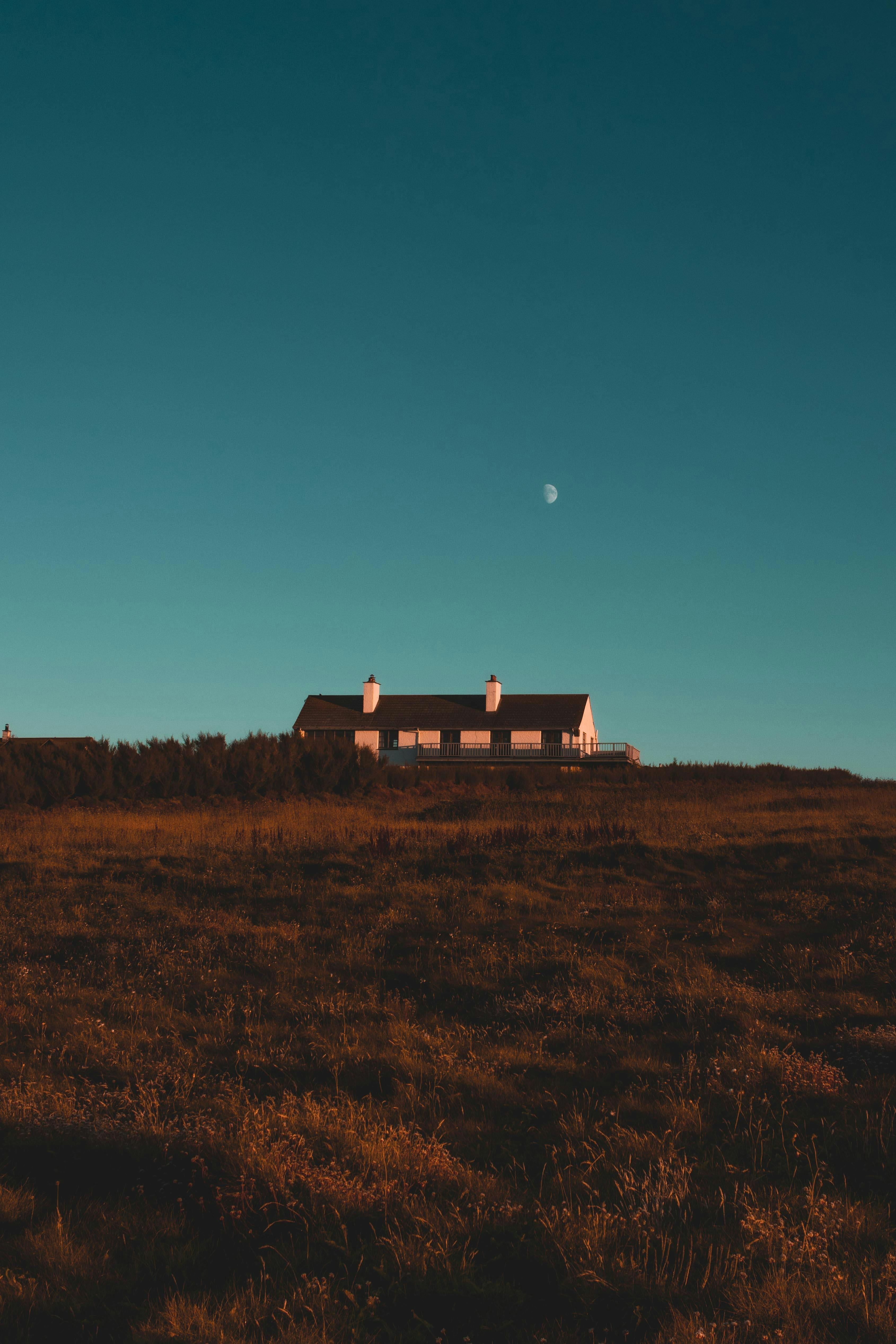 a house in the countryside under a clear sky