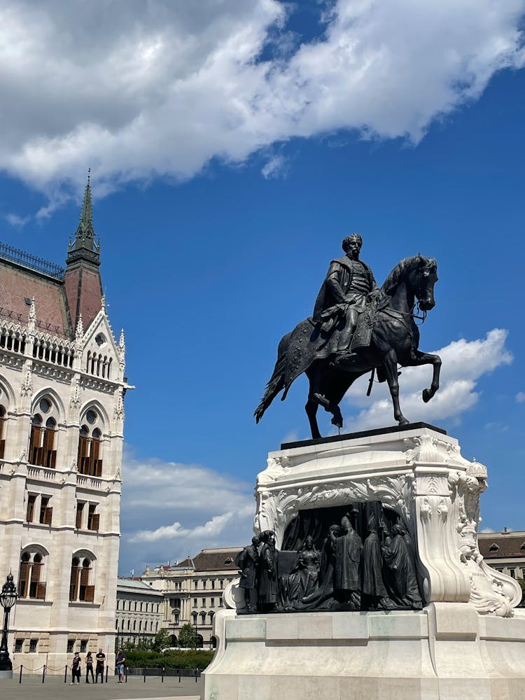 Black Concrete Statue Under The Blue Sky