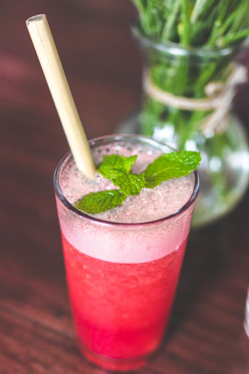 Free Drinking Glass With Pink Beverage And Mint Leaves Stock Photo
