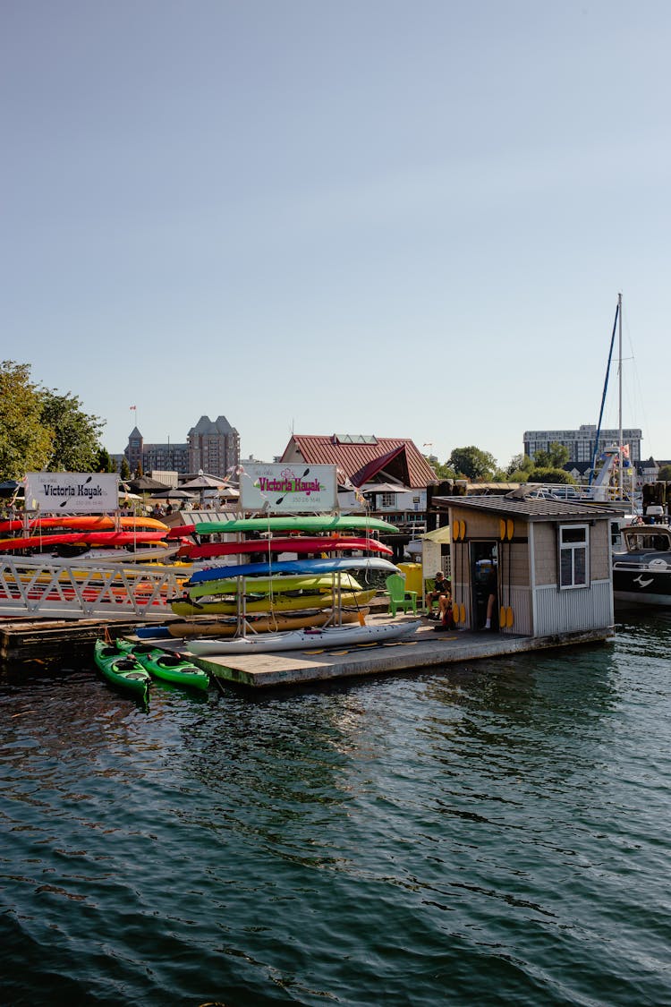 Canoes At Water Station At Pier