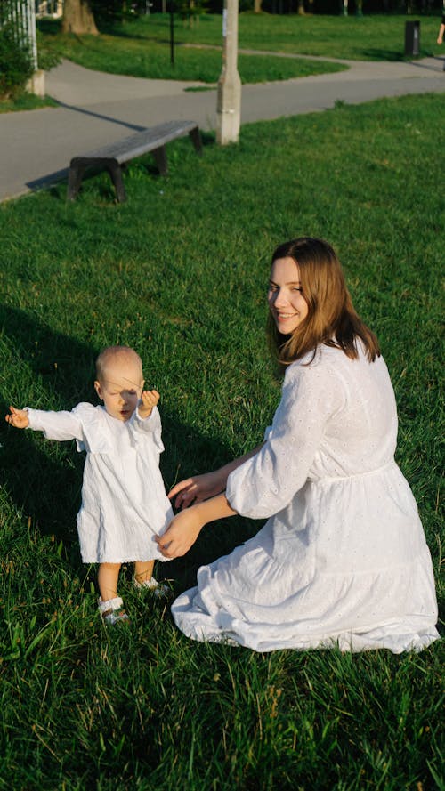 Mother and Daughter wearing White Dress