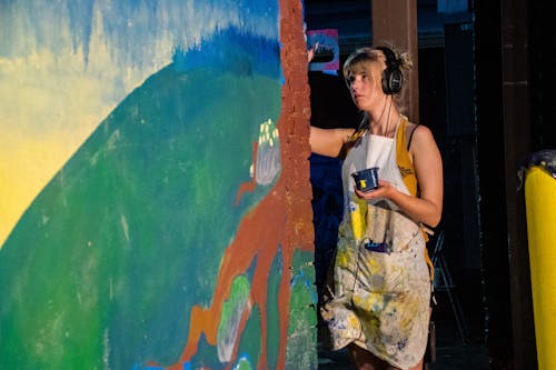 Woman Wearing Black Headphones Painting