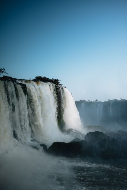 Stunning Iguazu Falls cascading in Foz do Iguaçu, Brazil on a clear day.