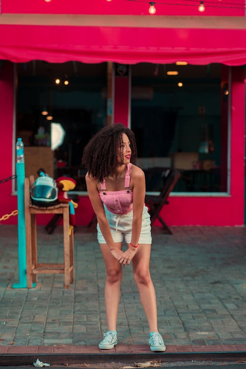 Woman in Pink Tank Top Looking Sideways 