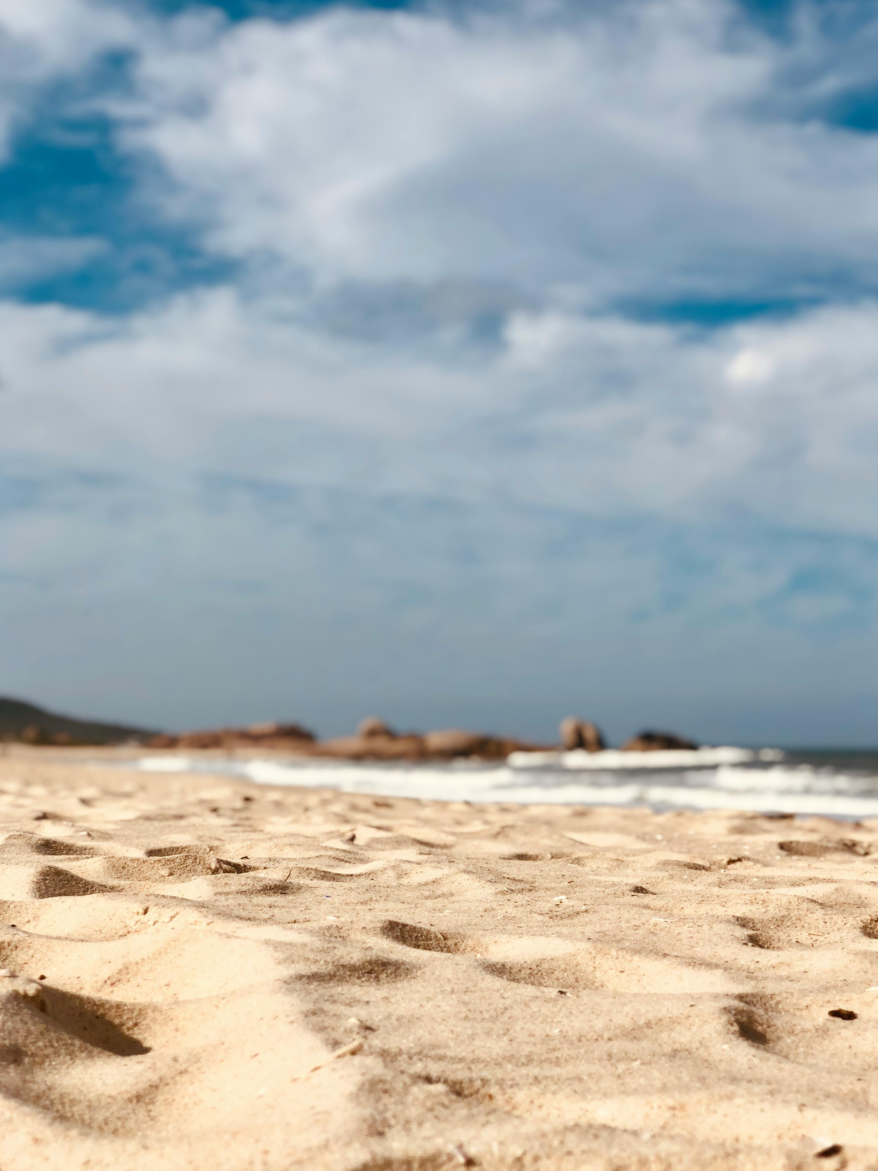 Beachside footprints, oceans canvas imprinted with tales of sandy strolls  and contemplation Vertical Mobile Wallpaper AI Generated 30316608 Stock  Photo at Vecteezy