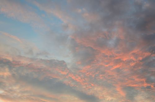 Free Beautiful sunset sky with soft pink and blue clouds creating a serene atmosphere. Stock Photo