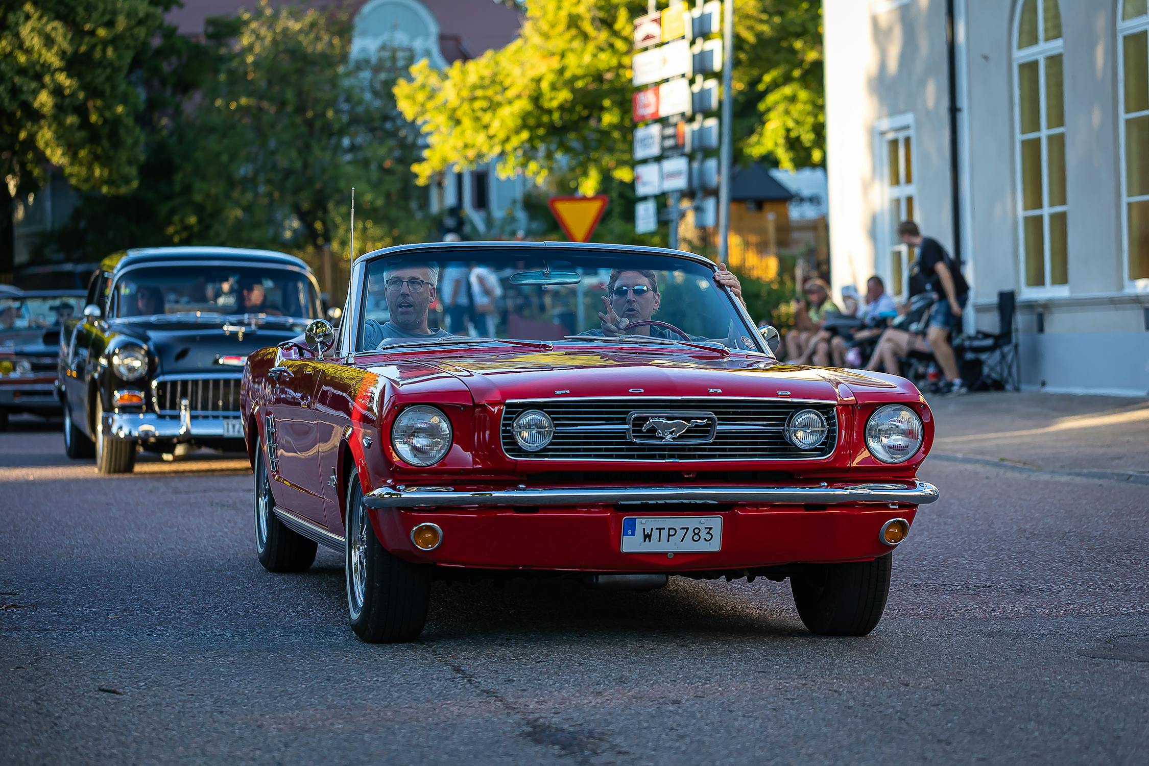 Men Riding Red Vintage Car · Free Stock Photo