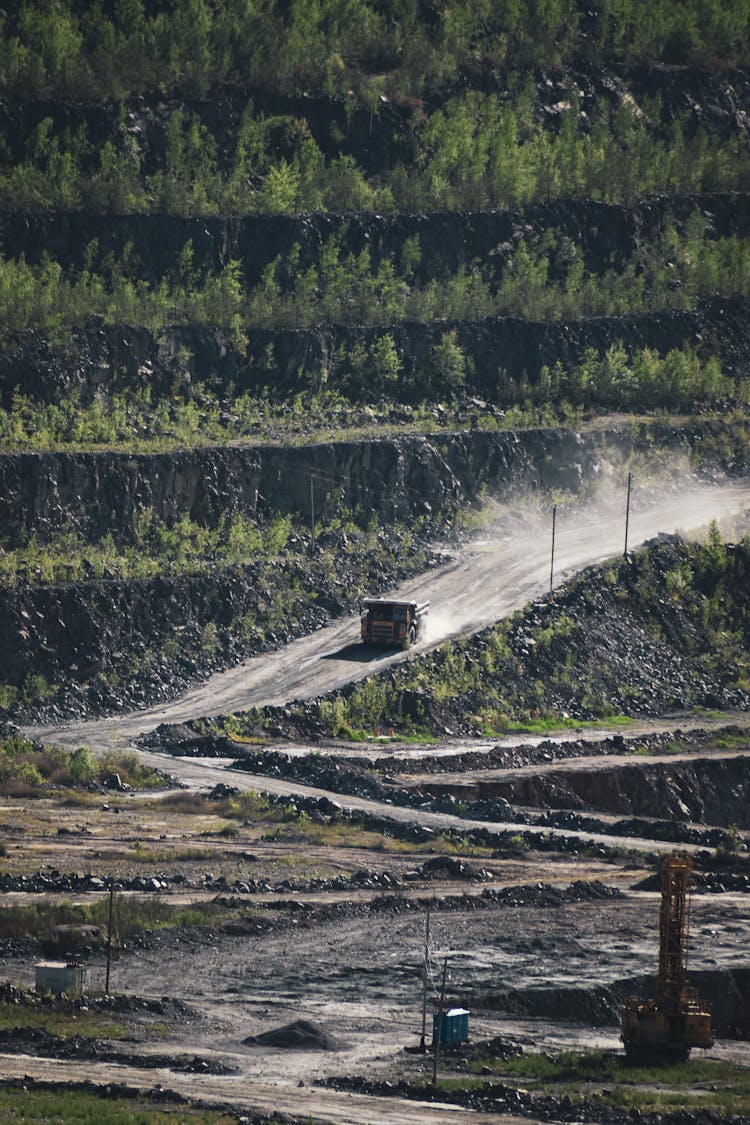 Long Shot Of A Truck In A Quarry Site 