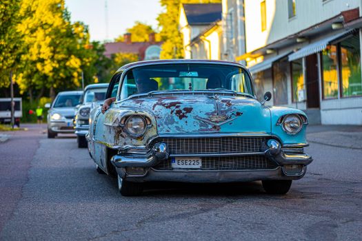Blue Classic Car on Road
