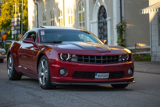 Red Chevrolet Camaro on Road