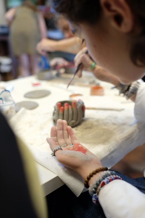 Clay and Paint on Person's Hand